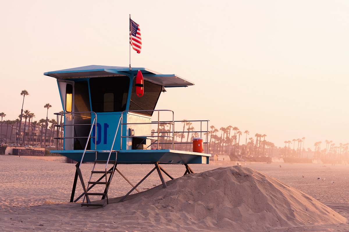 huntington beach white sand beach during daytime kiosk